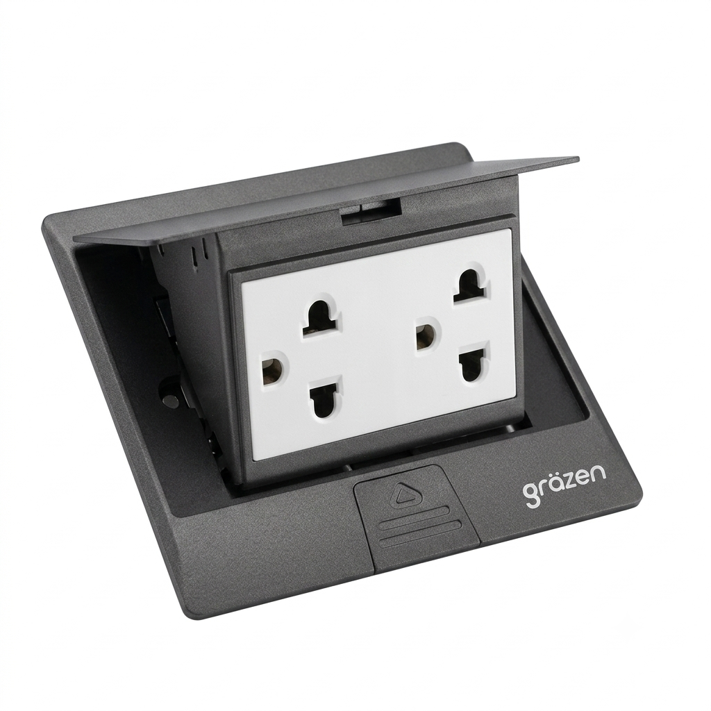 A black outdoor waterproof double outlet socket cover with a white double AC power plug visible inside, featuring the 'grözen' brand logo on the front base.