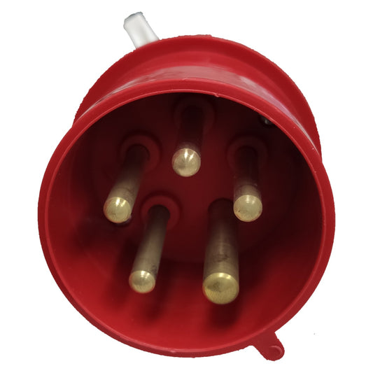 Red electrical plug with brass pins on a white background