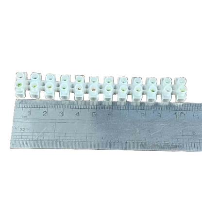Grippes 5A PVC terminal block 12 pairs shown with a ruler for size reference