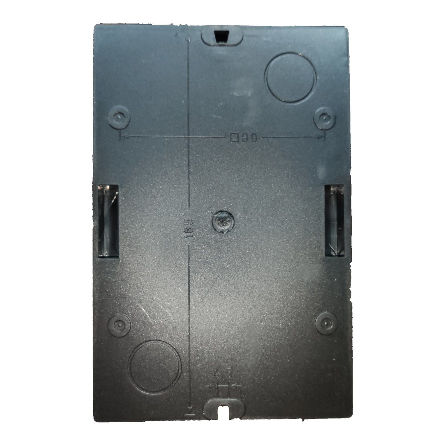 Black rectangular object with circular and rectangular cutouts on a white background