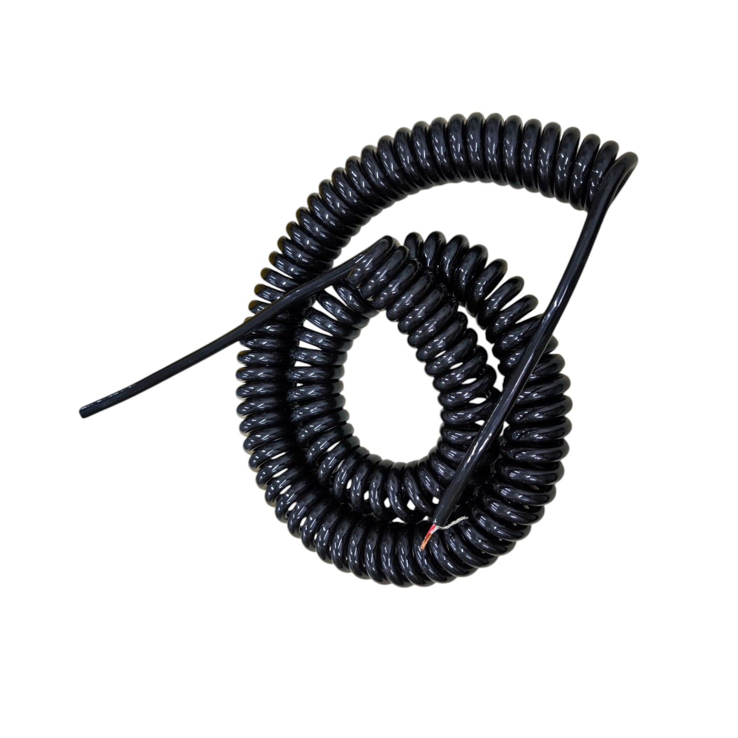 Coiled black cable on a white background