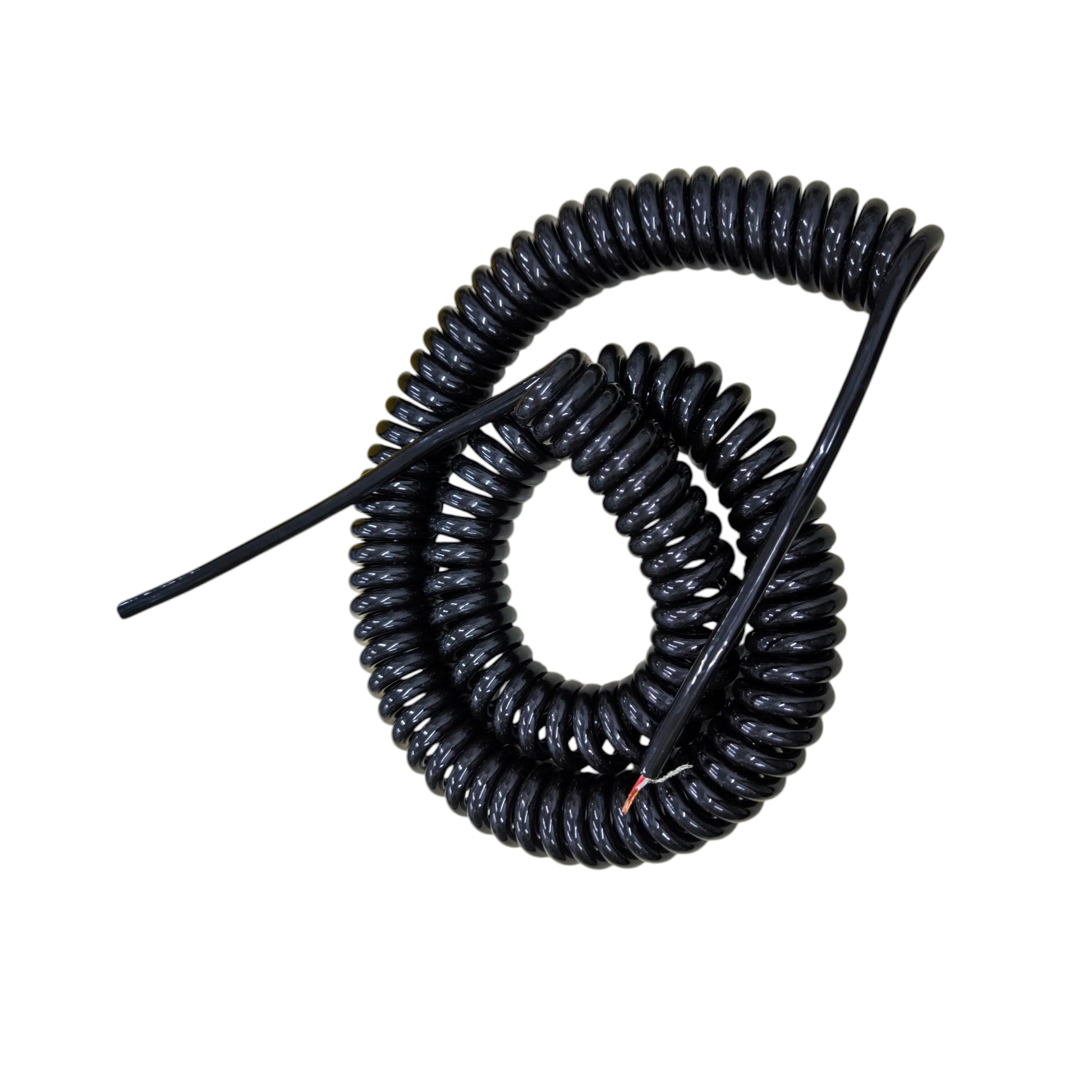 Coiled black cable on a white background