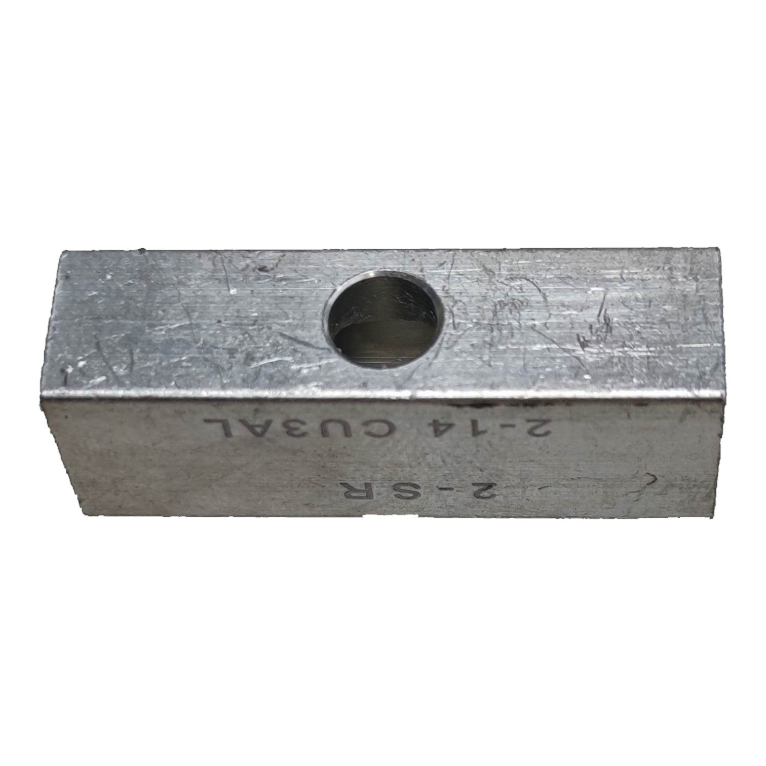 Metal block with a hole and engraved text on a white background