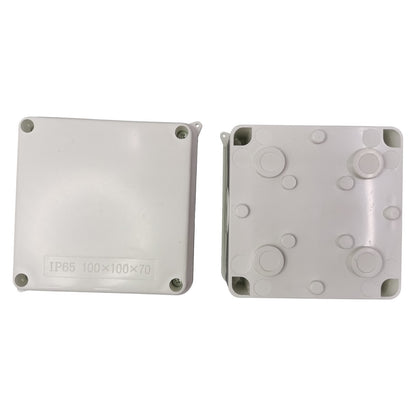 Two gray plastic enclosures with circular cutouts on a white background