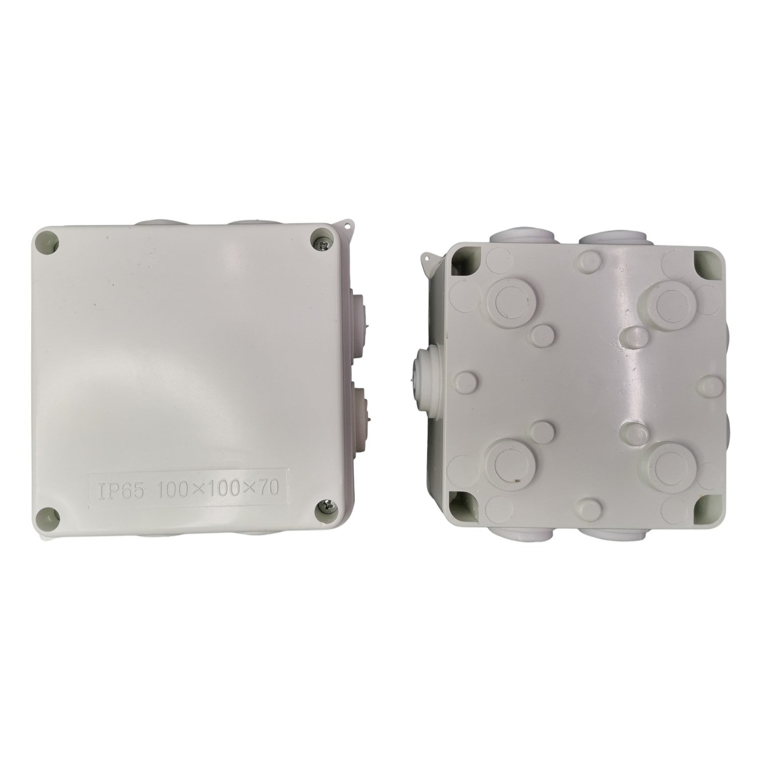 Two gray plastic junction boxes on a white background