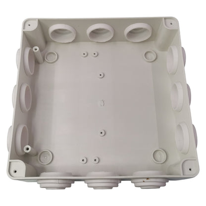 Gray plastic junction box with multiple holes on a white background