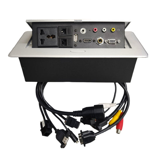 A multi-port power strip and cable management box with an open silver metal panel revealing multiple electrical outlets, video/audio ports, and attached black cables on a white background.