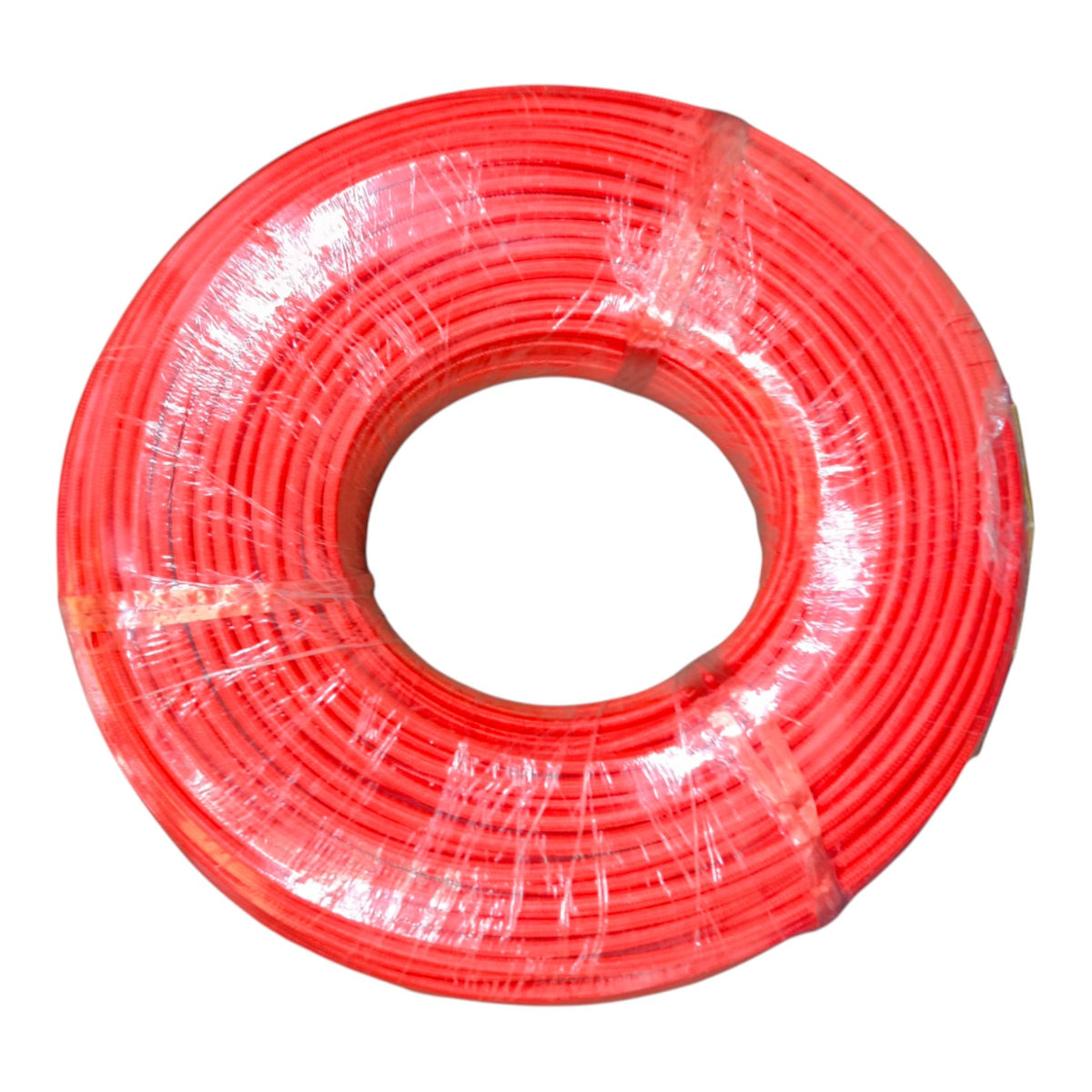 A large spool of bright red cable or wire wrapped in clear plastic, shown against a plain white background.