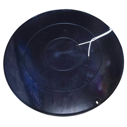 A round black plastic pan or tray with concentric circular grooves, a small hole near the bottom right, and a white wire attached, shown on a plain white background.