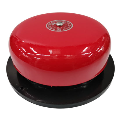 A red dome-shaped fire alarm bell mounted on a black circular base, shown against a plain white background.