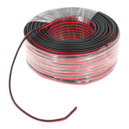 A coil of black electrical wire with a red inner layer, wrapped in clear plastic, on a white background.