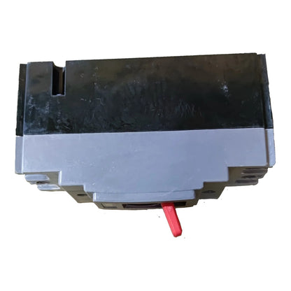 A gray and black industrial electrical component or switch module with a small red lever, shown on a plain white background.