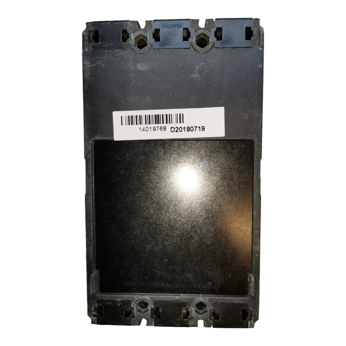 A black plastic electronic module or panel with a white barcode label on the front, photographed against a plain white background.