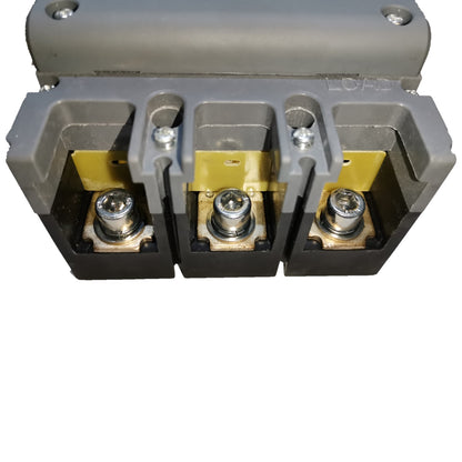 A three-terminal electrical connector or terminal block with gray plastic housing, black base sections, yellow insulating tabs, and silver screw terminals, shown on a plain white background.