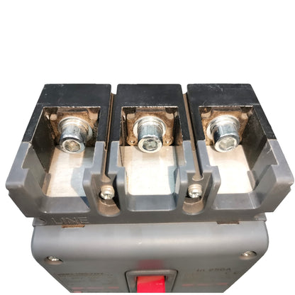 A close-up of a three-terminal electrical contactor or switch component with metal screw terminals and a red switch lever on a gray housing, isolated on a white background.