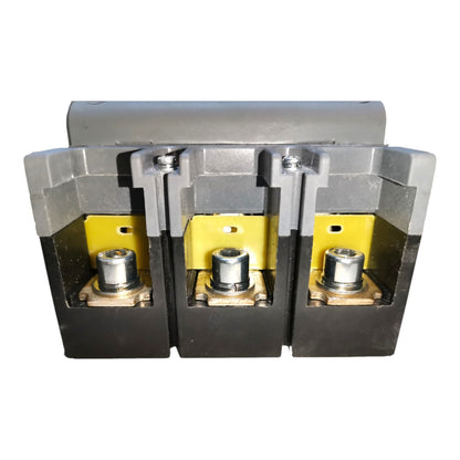 A three-phase electrical terminal block connector with gray plastic housing, yellow internal plates, and three metal screw terminals, shown on a plain white background.