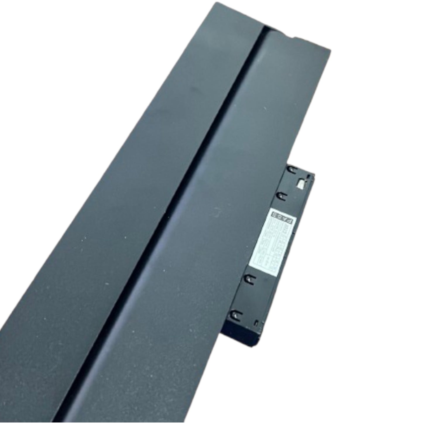 A long, dark gray metal track or channel with a small attached black bracket and a white product label, photographed on a plain white background.
