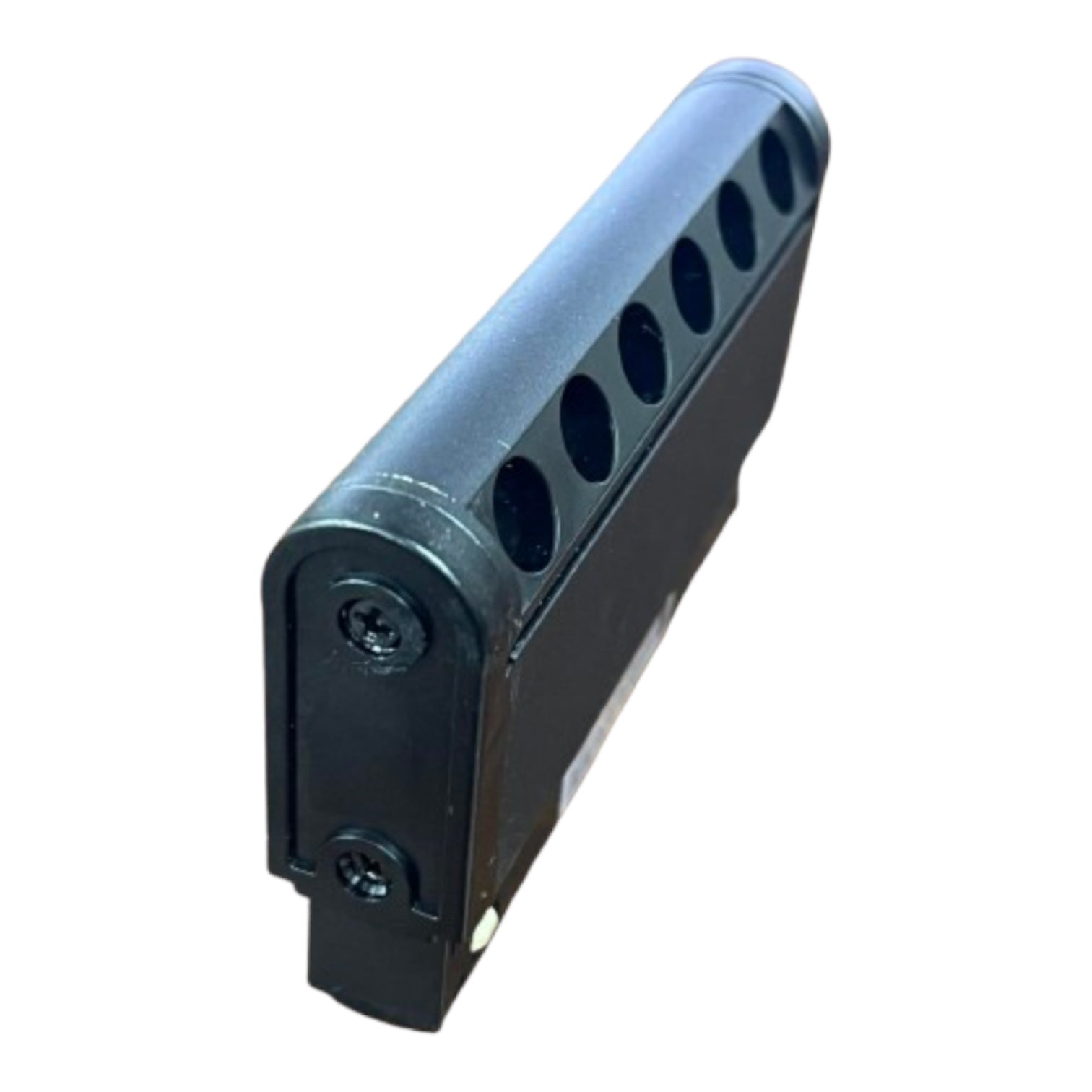 A black plastic multi-dose vial or cartridge container with six circular cutouts on top and two screws on the side, shown on a plain white background.