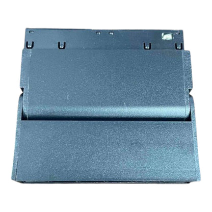 A dark gray textured metal panel or cover with a brushed finish, photographed from a top-down angle against a plain white background.
