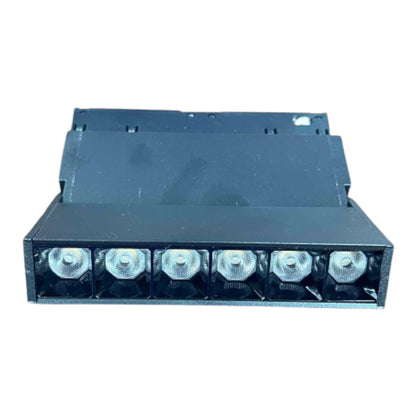 A black rectangular electronic component or light fixture module with six circular silver and black front elements, shown against a plain white background.