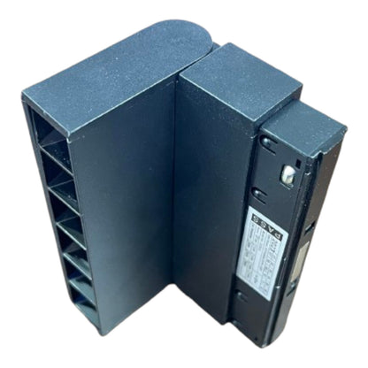 A dark gray industrial electronic component, likely a relay or terminal block module, photographed on a clean white background.