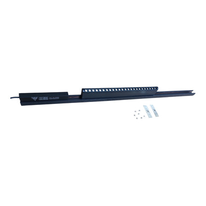 A long black metal track or channel rail shown horizontally on a plain white background, with a small set of mounting hardware and two small labels placed below it.