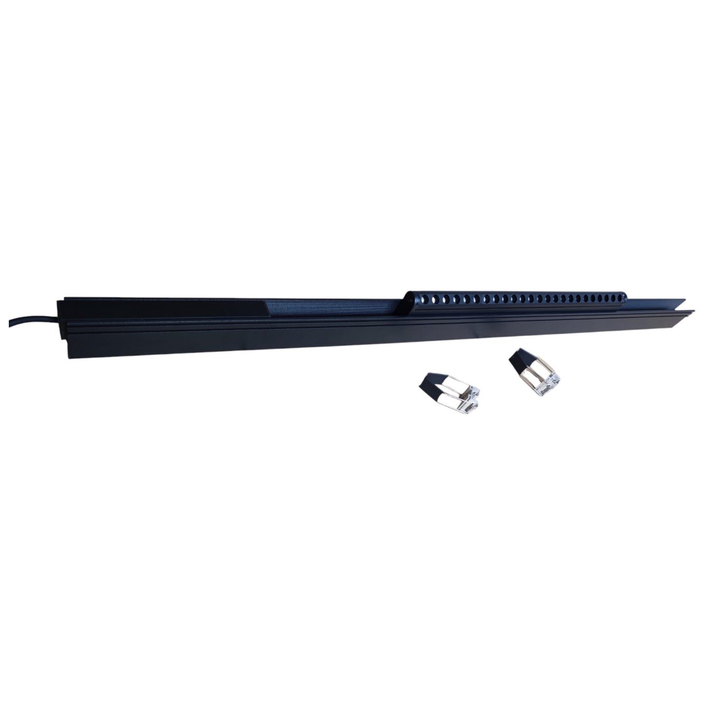 Long black rectangular object with two small cylindrical items on a white background