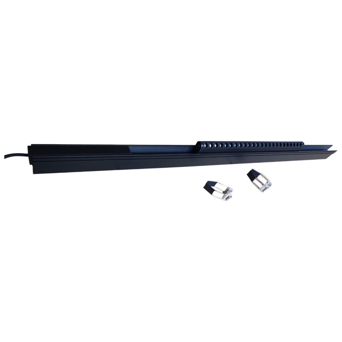 Long black rectangular object with two small cylindrical items on a white background