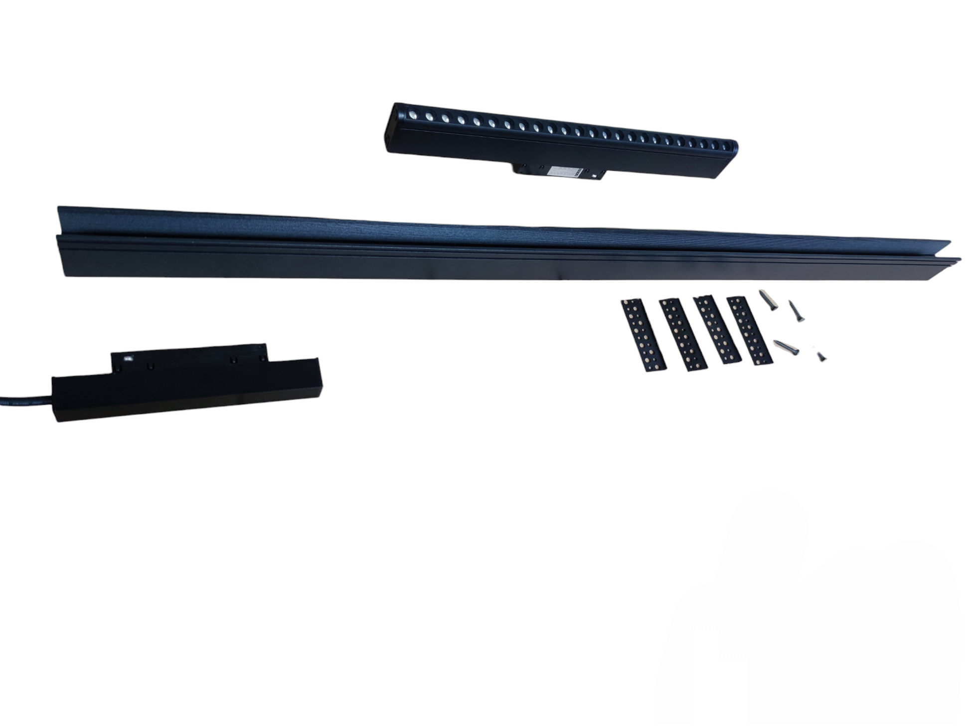 Set of black LED strip lights and connectors on a white background