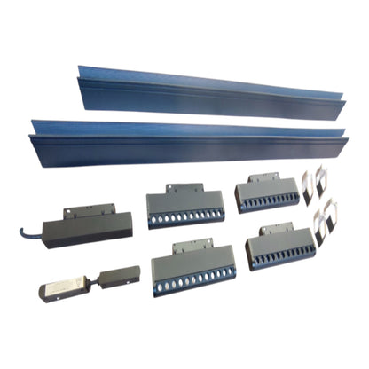 A set of industrial metal components, including two long blue rails and several gray sensor or connector blocks, arranged on a plain white background.