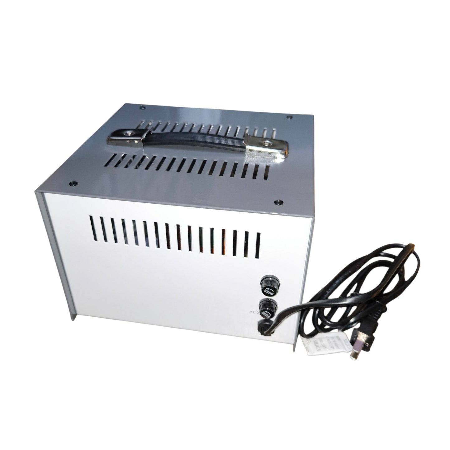Metal box with ventilation grilles and power cable on a white background