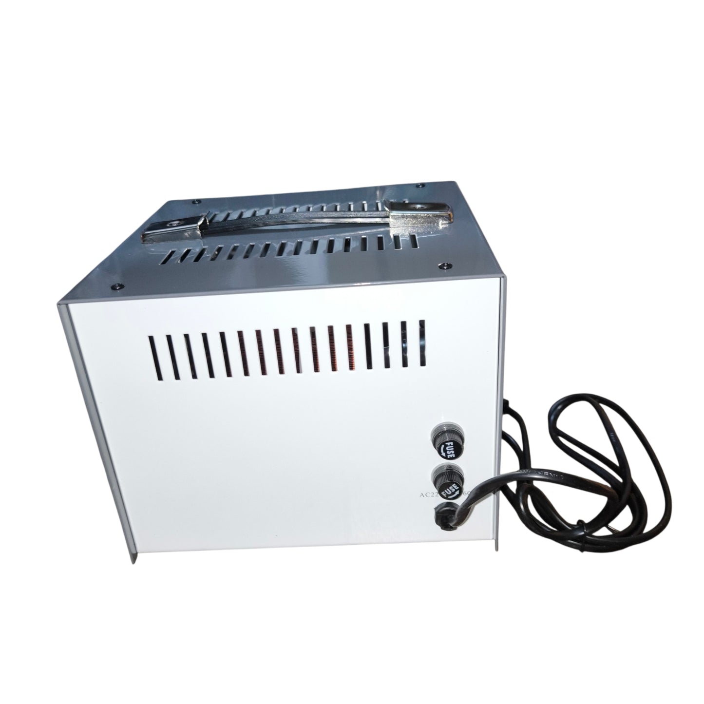 Metallic rectangular device with power cord on a white background