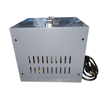 Metallic box with power cord on a white background