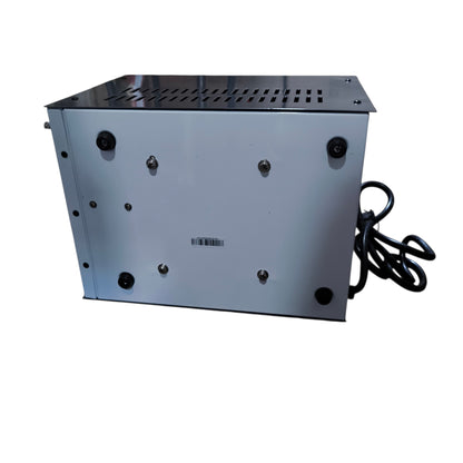 Metallic grill with a power cord on a white background