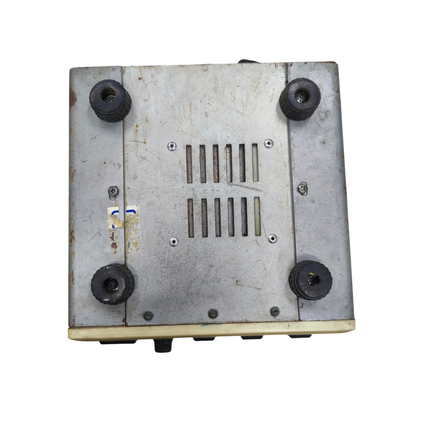 Metal box with ventilation grille and four black screws on a white background
