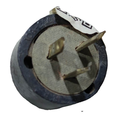 A small cylindrical electronic component with a dark gray to black plastic body, a circular gray metal center, and three metal pins, shown on a plain white background.