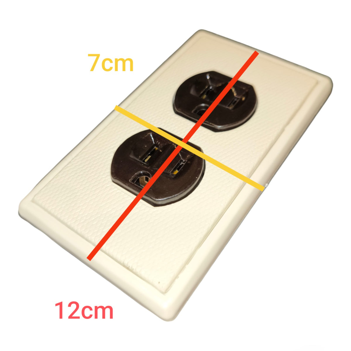 An off-white double outlet electrical wall plate shown on a white background with yellow and red measurement lines and text indicating dimensions 7cm and 12cm.