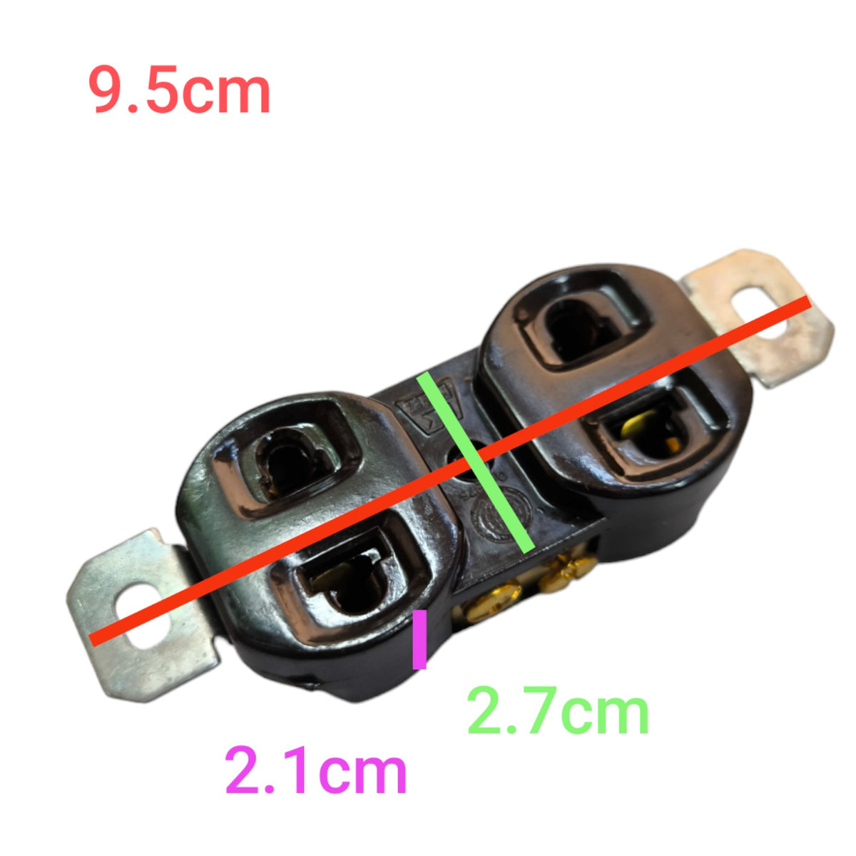 A black electrical outlet component with metal terminal tabs on both ends, shown on a white background with red, green, and purple dimension labels indicating 9.5cm, 2.
