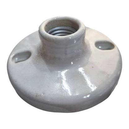 A white ceramic electrical socket or connector with a threaded center post and two side mounting holes, shown on a plain white background.