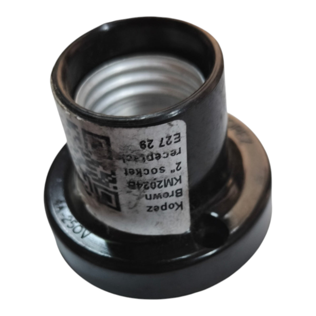 A black plastic threaded socket fitting with a white paper label showing product details, photographed on a white background.