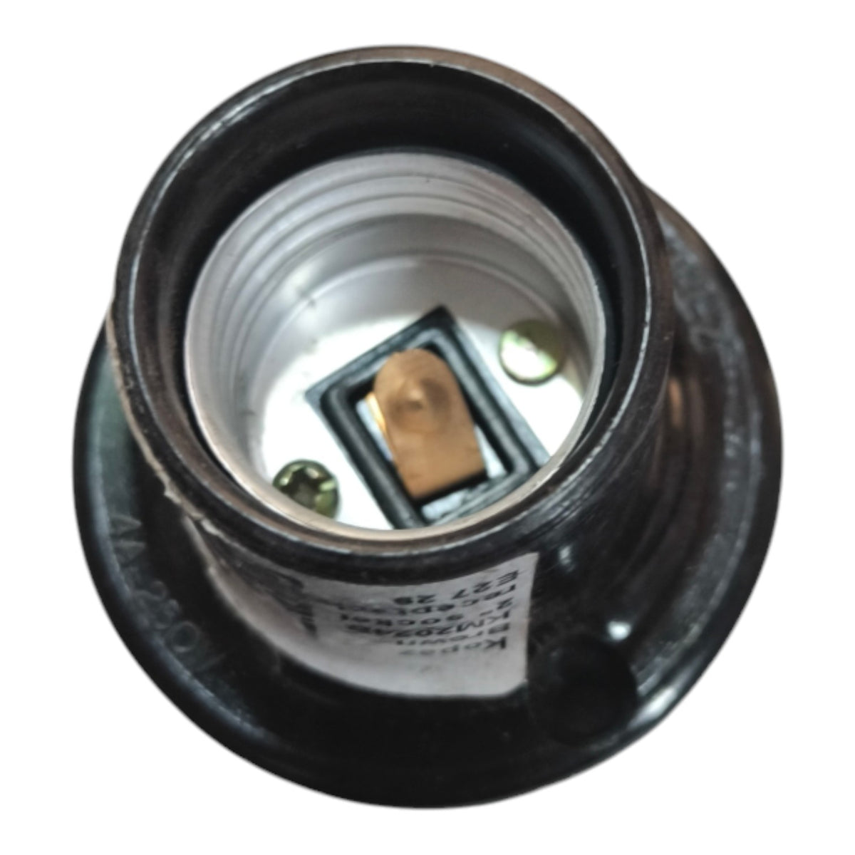 A close-up top-down view of a black electrical light socket with a silver-colored inner threaded body and a gold-colored contact terminal, isolated on a white background.