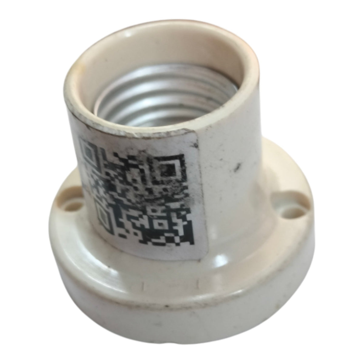 Two ceramic light bulb socket adapters on a white background, one in a warm off-white/cream color and one in glossy black.