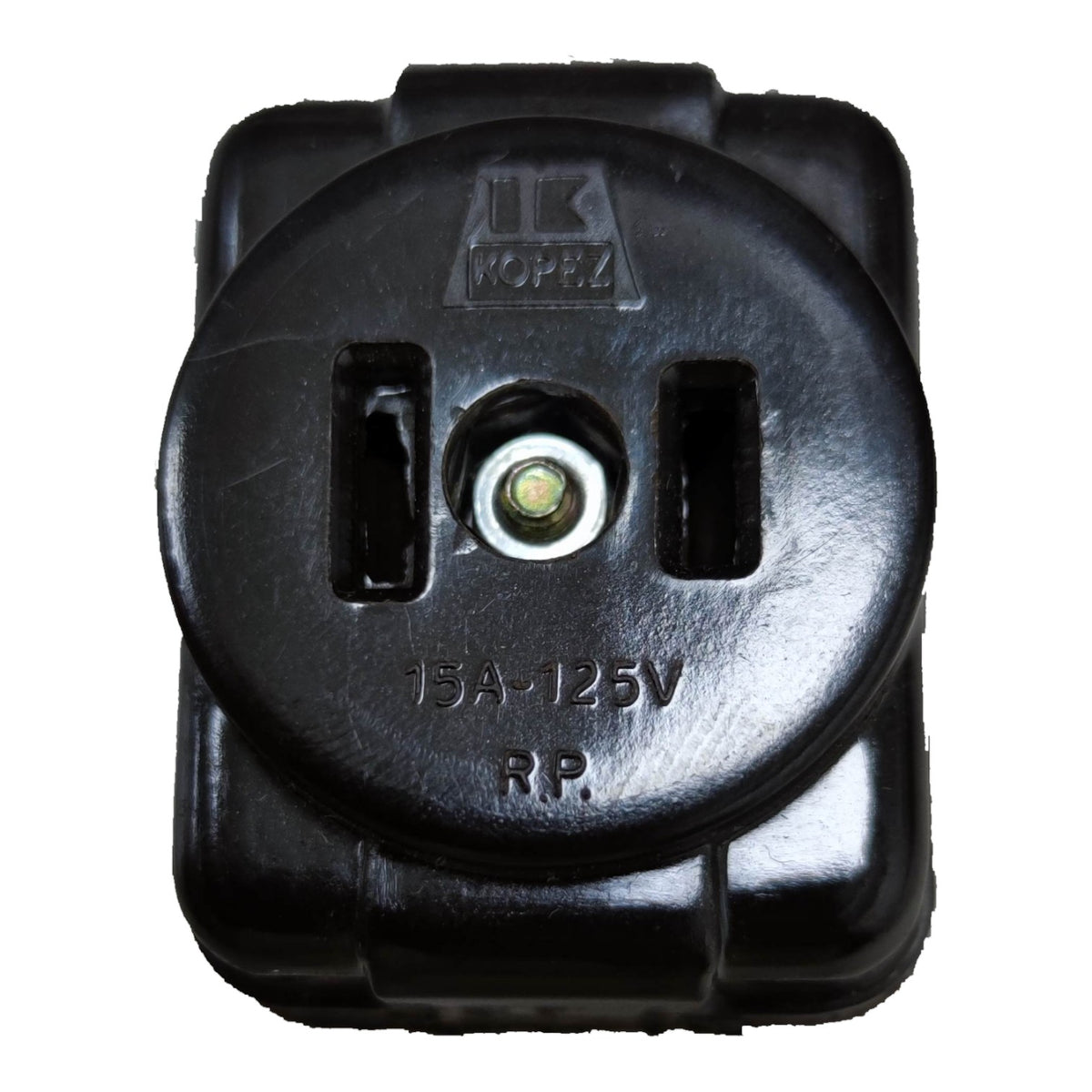 A black molded plastic electrical outlet plug component with a central metal contact point, featuring molded text 'IK HOPEZ' and '15A-125V RP.' on a plain white background.