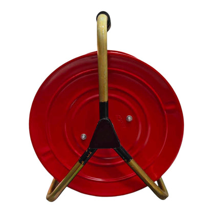 A red circular plastic or metal container with a three-legged stand made of light wood and black plastic connectors, shown against a plain white background.