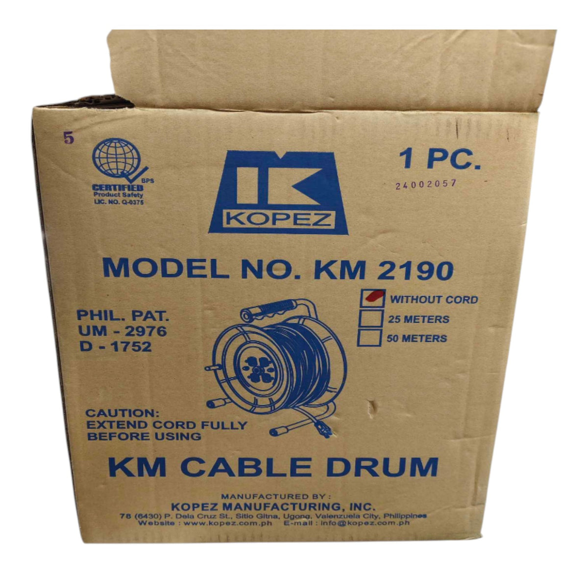 A brown cardboard box for Kopez KM 2190 cable drum, featuring blue printed text and a diagram of the product on the front, photographed on a white background.