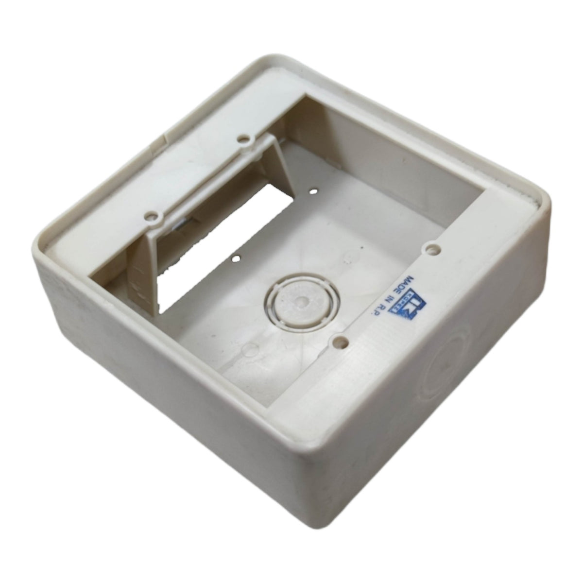 A square off-white plastic electrical junction box or socket housing, shown at an angle on a plain white background.
