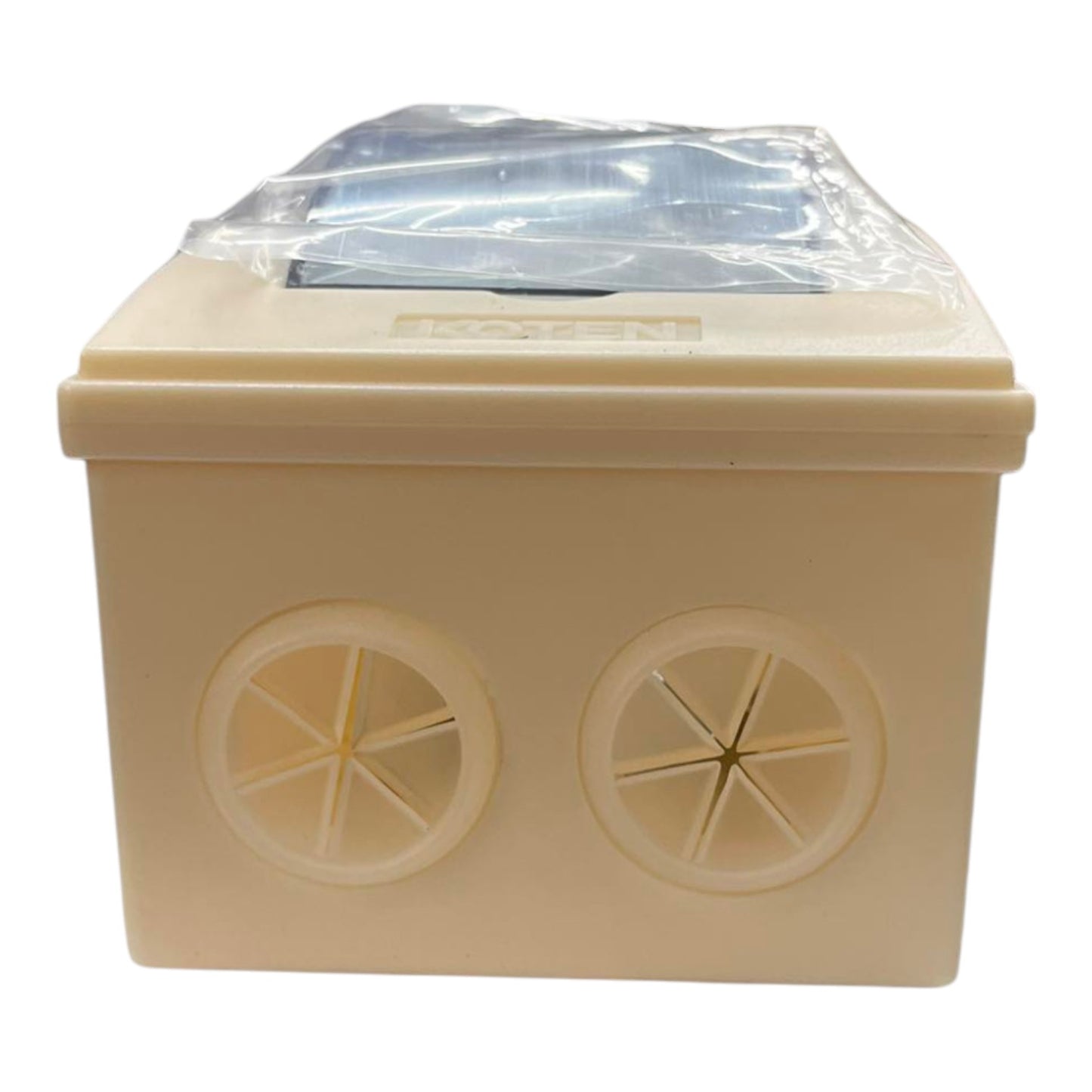 Beige rectangular box with two circular vents on a white background