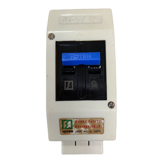 A Koten circuit breaker module with a cream-colored plastic housing, a black internal compartment, and a blue switch handle, shown on a white background.
