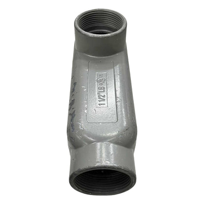 Metal pipe fitting with threading on a white background