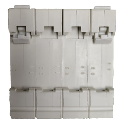Stack of gray plastic components on a white background
